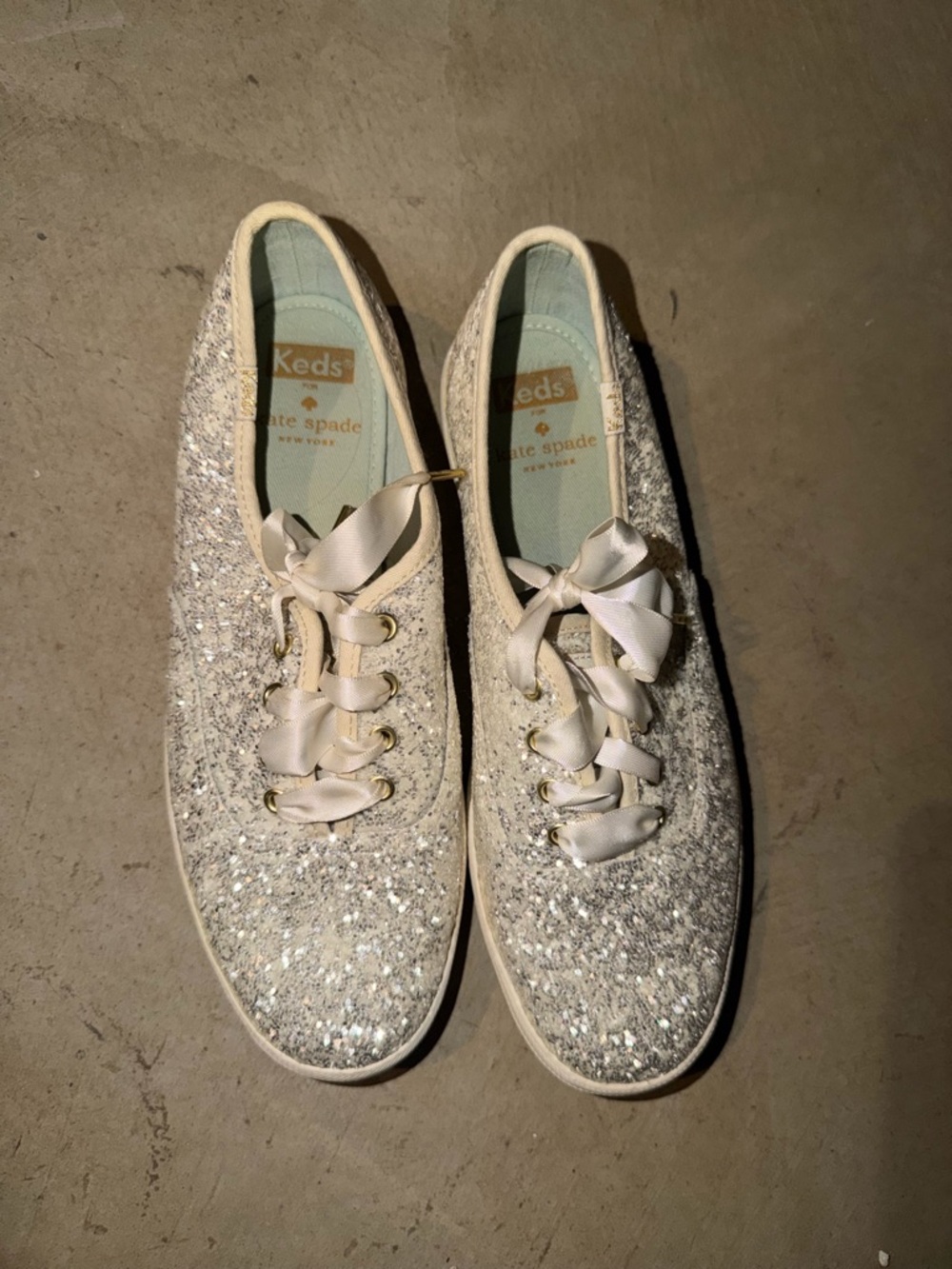 kate spade Glitter Ribbon Lace Sneakers in Silver and Cream